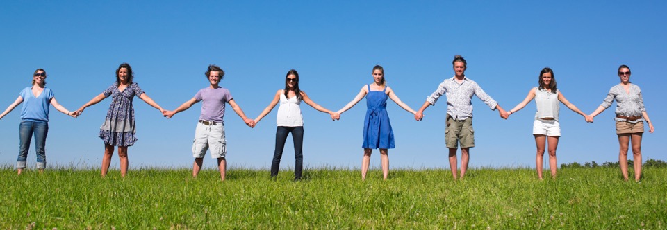 photo of PLM happy people standing in a field