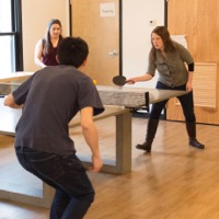 photo of PLM workers playing ping pong